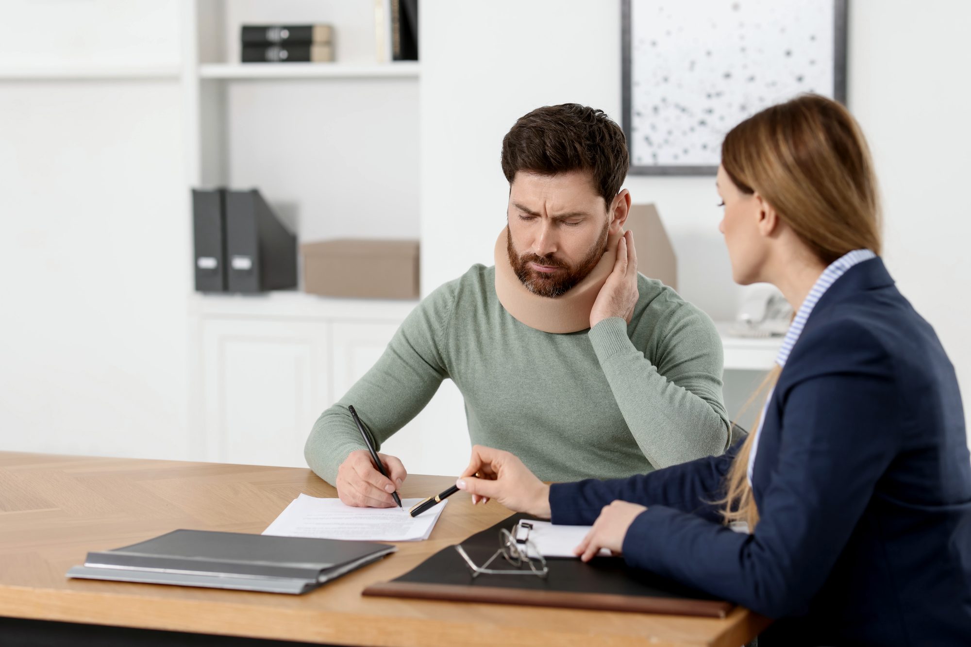 Personal injury attorney consulting with client