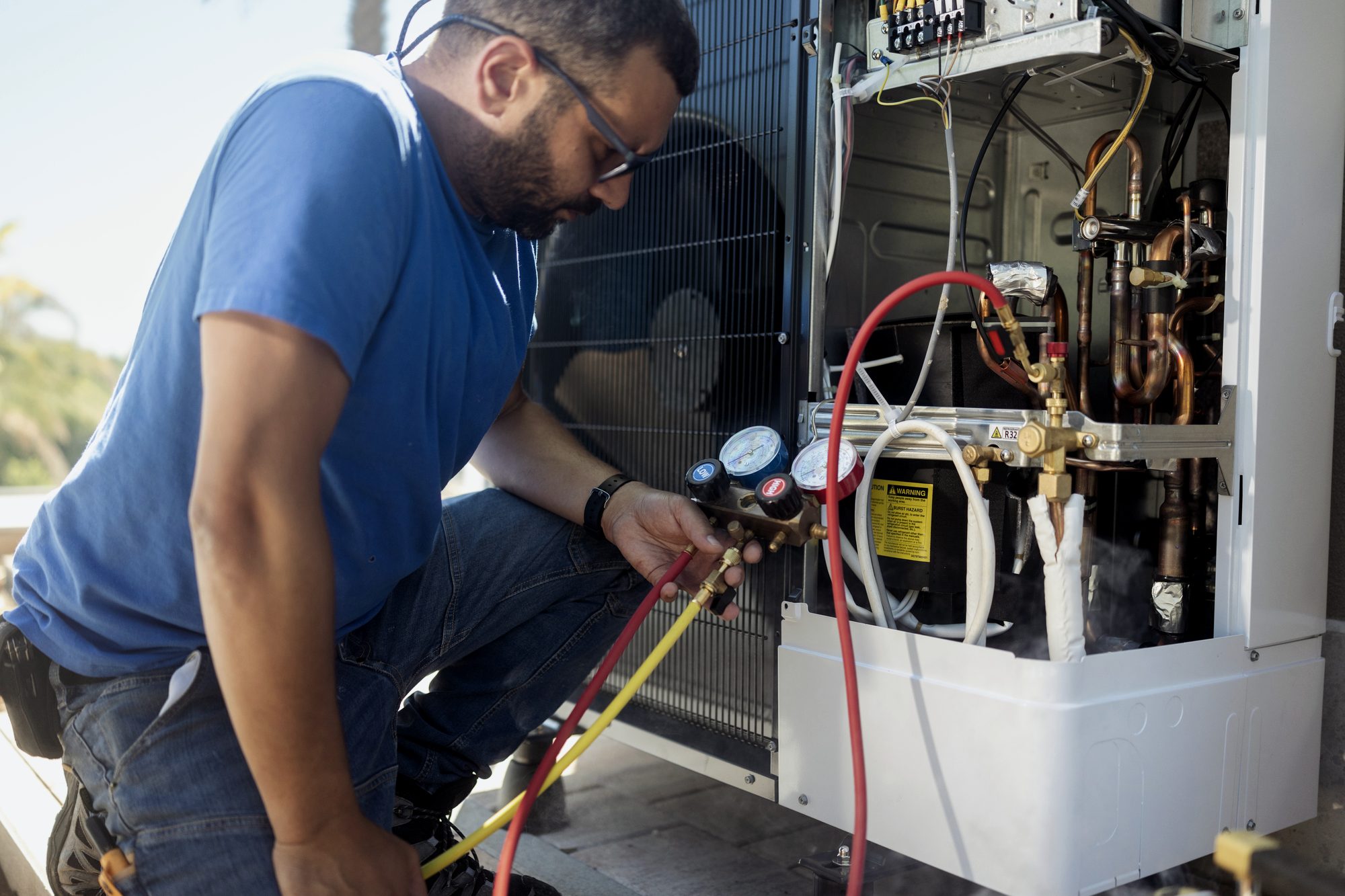HVAC technician servicing equipment