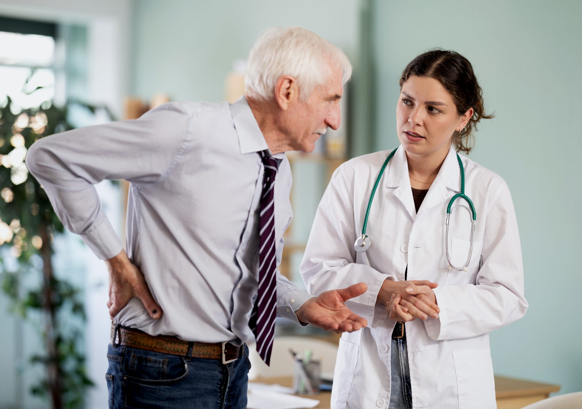 Pain management physician consulting with patient